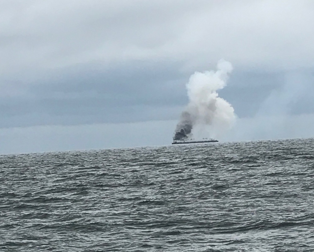 Coast Guard, partner agencies respond to adrift burning barge
