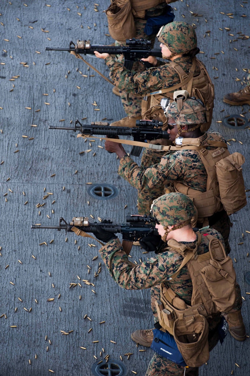 Marines shoot guns