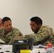 Operations officers go over details during Saber Guardian 17