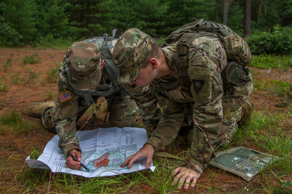 Cpl. Carlo Deldonno and Staff Sgt. Jonathan  Anderson plan their course of attack