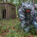 Spc. Wantea Seong carries Spc. Kenny Ochoa to safety