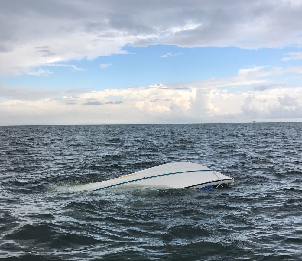 Coast Guard rescues 4 from boat taking on water