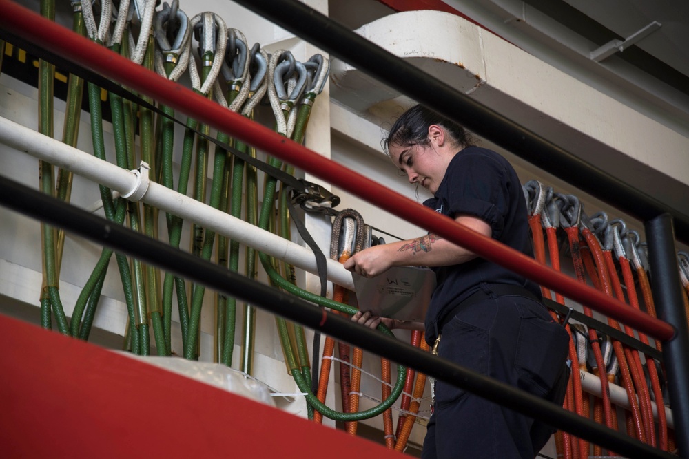 USS San Diego (LPD 22) Sailor Conducts Inventory