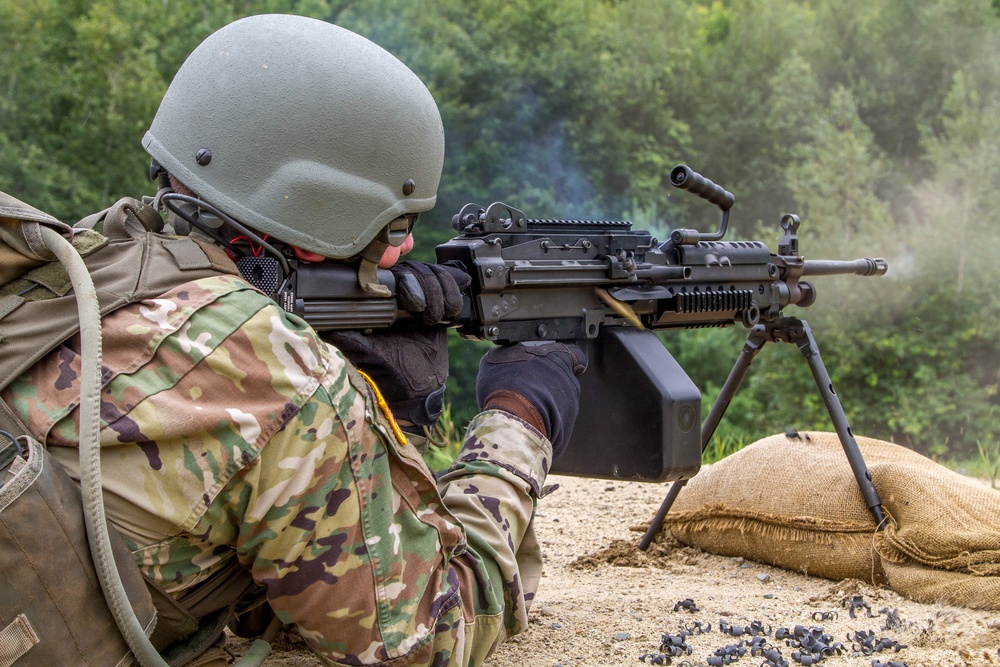 Staff Sgt. Jonathan Anderson fires a M-249 squad automatic weapon