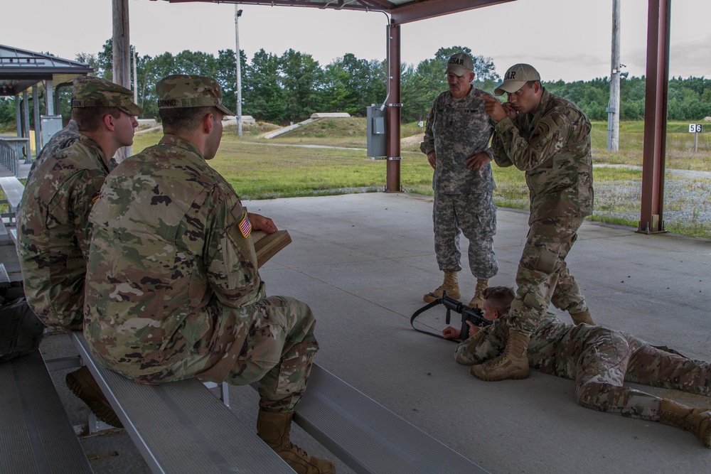 Members of the U.S. Army Marksmanship Team, illustrate proper firing positions with the M4 rifle