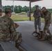 Members of the U.S. Army Marksmanship Team, illustrate proper firing positions with the M4 rifle