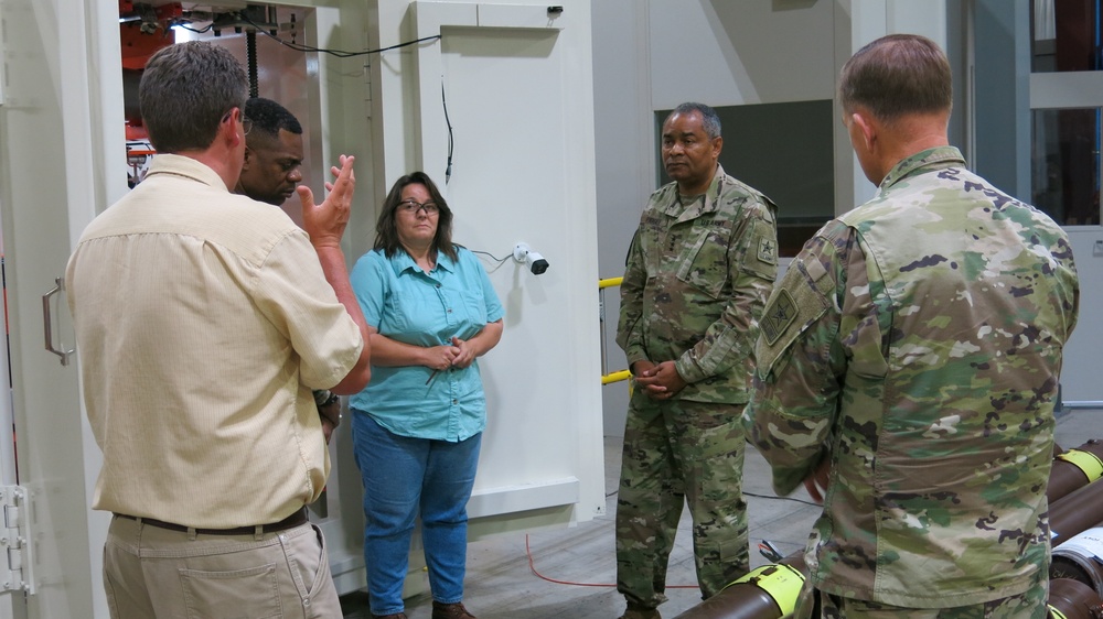 Sam Clippinger, Letterkenny Munitions Center, briefs Lt. Gen. Piggee on new RMIS X-Ray operations.