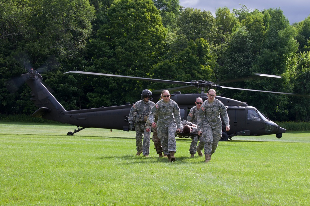 Soldiers Carry Litter from Blackhawk