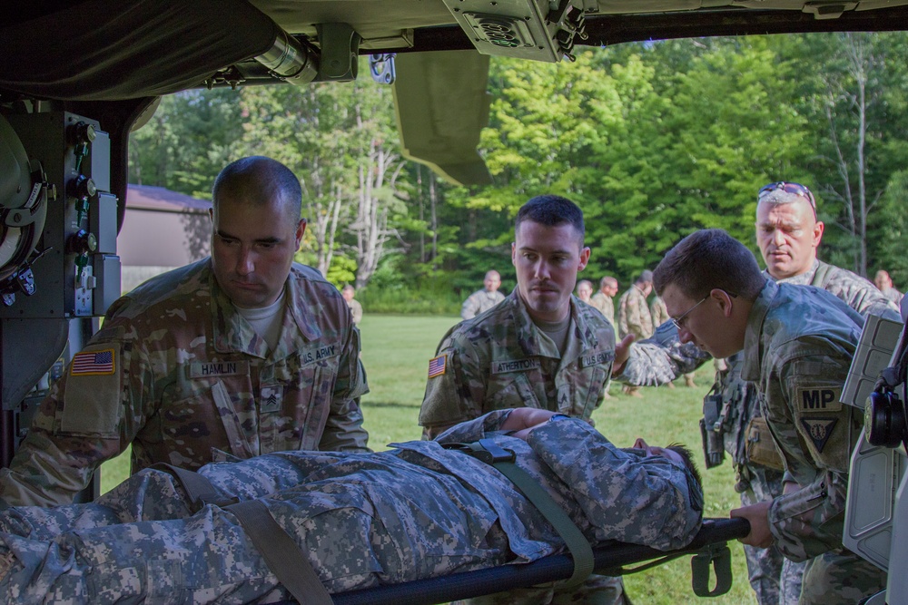 Soldiers Load Litter into Blackhawk