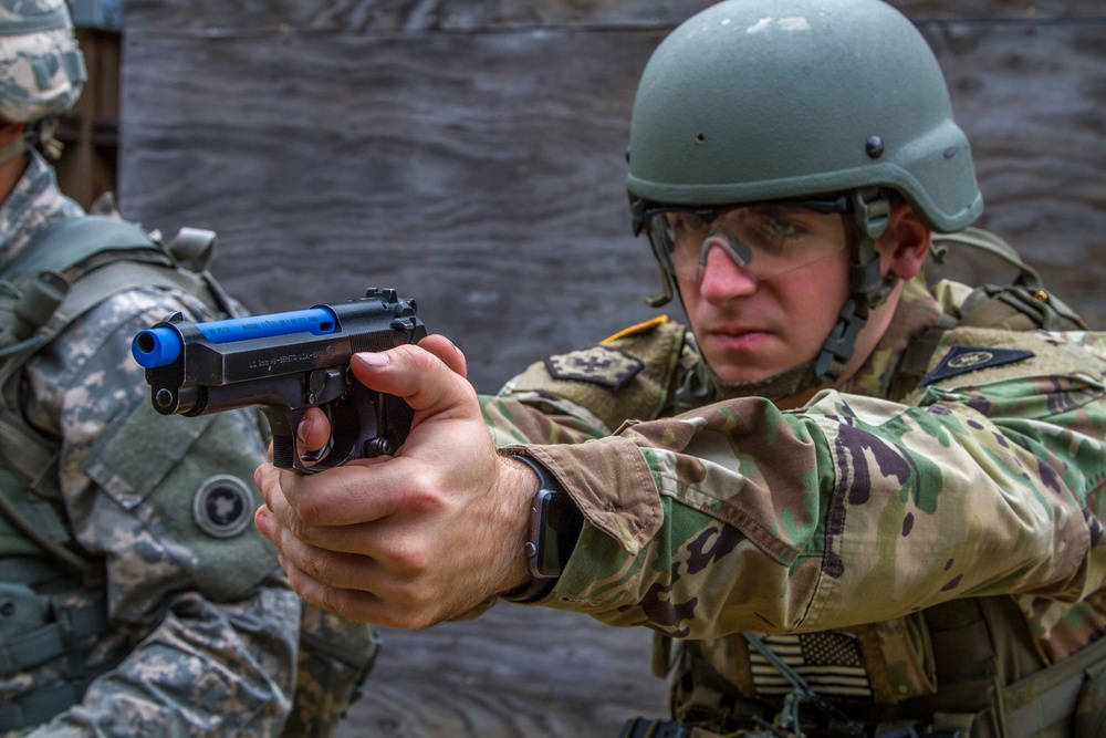 Staff Sgt. Jonathan Anderson practices with a M9 pistol