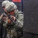 Spc. Kenny Ochoa and Spc. Wantea Seong peek around a corner