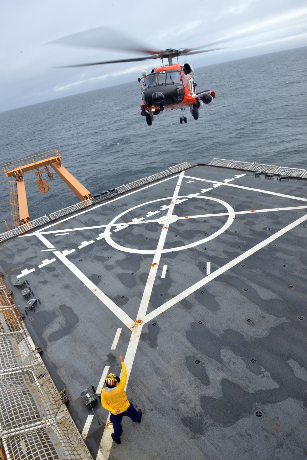 MH-60 Jayhawk helicopter air crew conducts “touch and go” landing and takeoff training operation with the Coast Guard Cutter Healy crewmembers