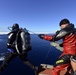 Joint Coast Guard-Navy dive team conduct cold water ice dive in the Arctic