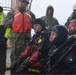 Joint Coast Guard-Navy dive team prepare for a cold water ice dive in the Arctic