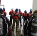 Joint Coast Guard-Navy dive team prepares for a cold water ice dive in the Arctic