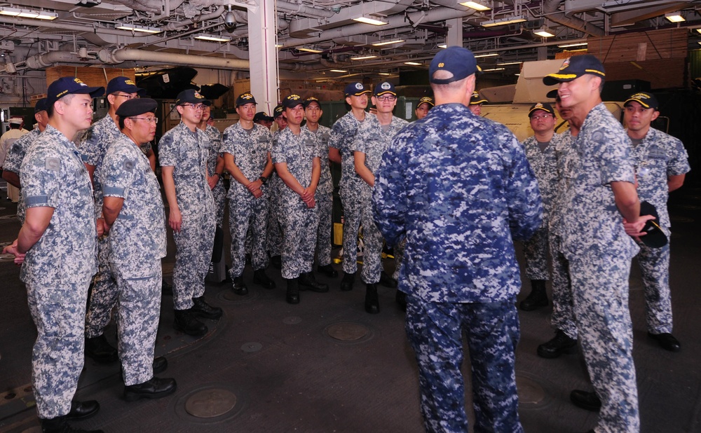 USS America Sailors greets Singaporean Navy