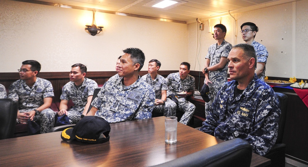 USS America Sailors  and Singaporean Sailors get brief