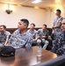 USS America Sailors  and Singaporean Sailors get brief