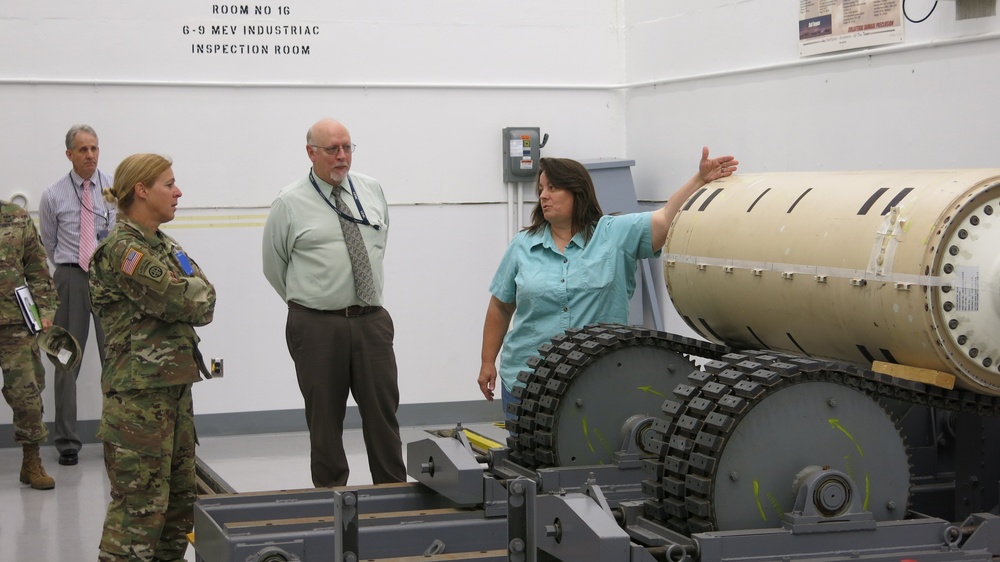 Lisa Michael briefs Col. Heidi Hoyle, Commander of Joint Munitions Command, on Letterkenny Munitions Center’s Non-Destructive Testing/X-Ray capabilities while Ed Averill and Keith Byers look on.