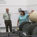 Lisa Michael briefs Col. Heidi Hoyle, Commander of Joint Munitions Command, on Letterkenny Munitions Center’s Non-Destructive Testing/X-Ray capabilities while Ed Averill and Keith Byers look on.