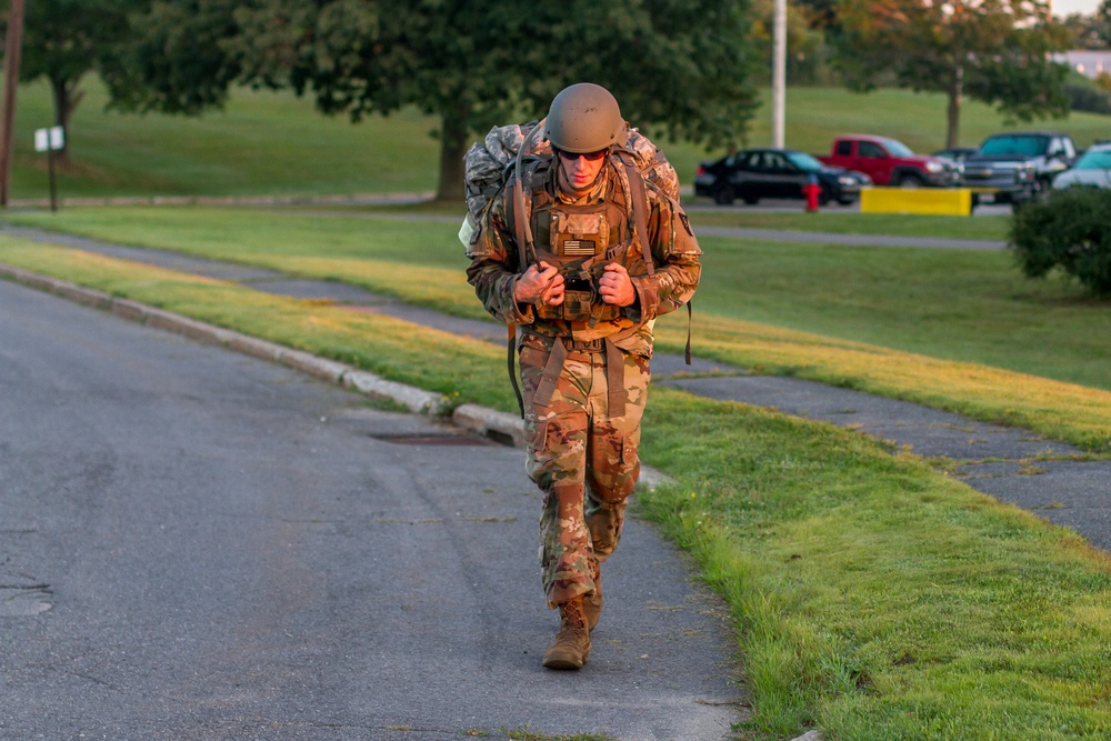 Staff Sgt. Jonathan Anderson marches with his ruck sack
