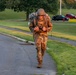 Staff Sgt. Jonathan Anderson marches with his ruck sack