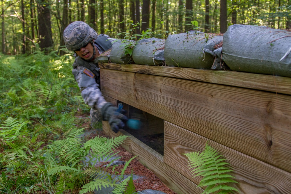 Spc. Kenny Ochoa tosses a grenade