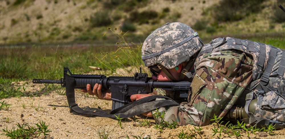 Cpl. Carlo Deldonno shoots a M4 rifle