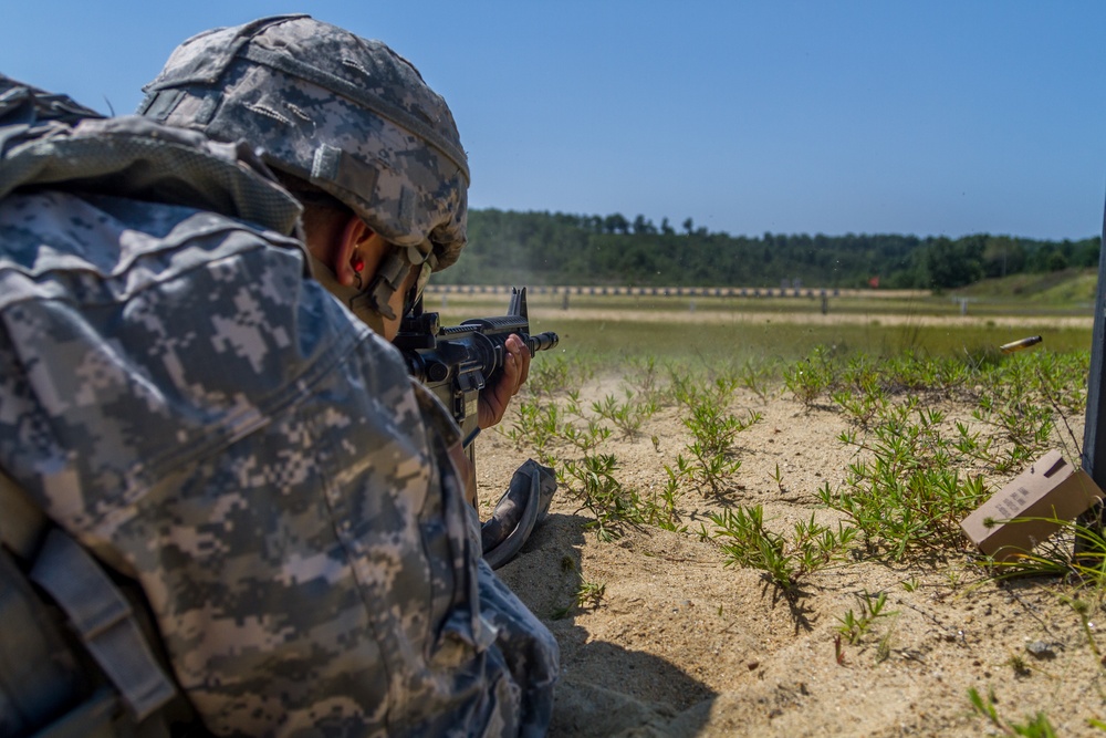 Spc. Kenny Ochoa shots a M4 rifle