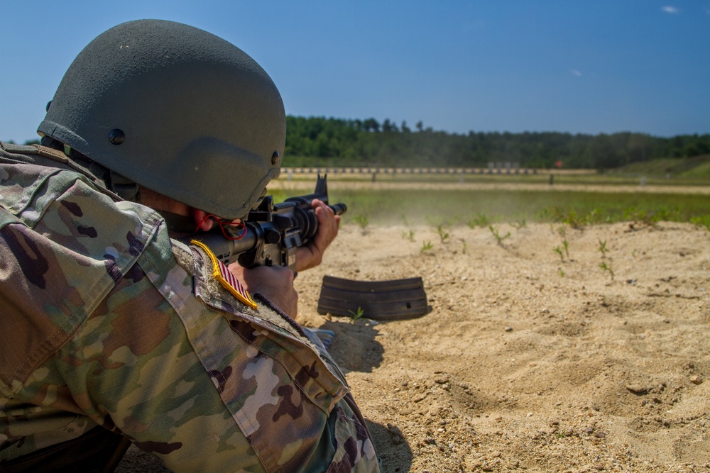 Staff Sgt. Jonathan Anderson shoots a M4 rifle