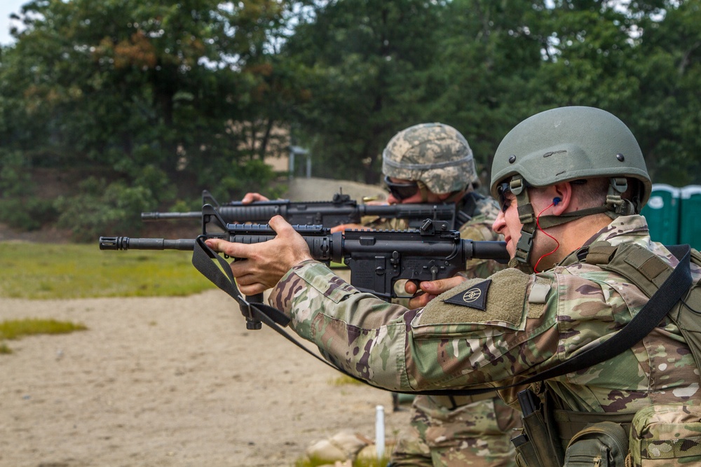 Staff Sgt. Jonathan Anderson and Cpl. Carlo Deldonno fire  M4 rifles