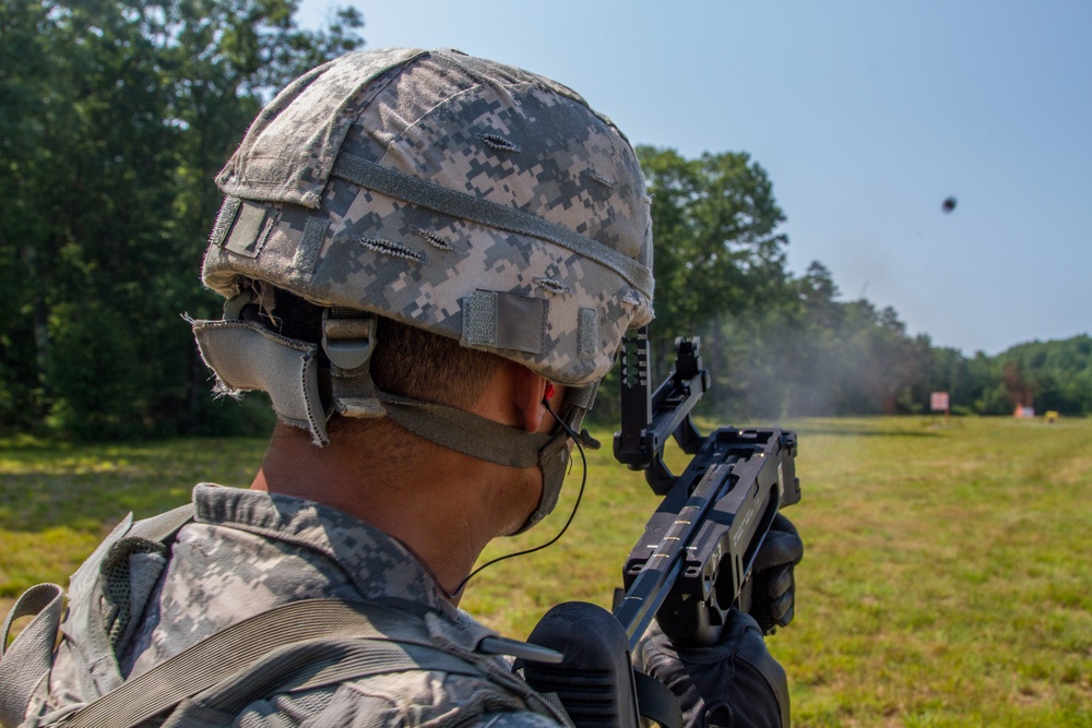 Spc. Kenny Ochoa shoots a M320 grenade launcher