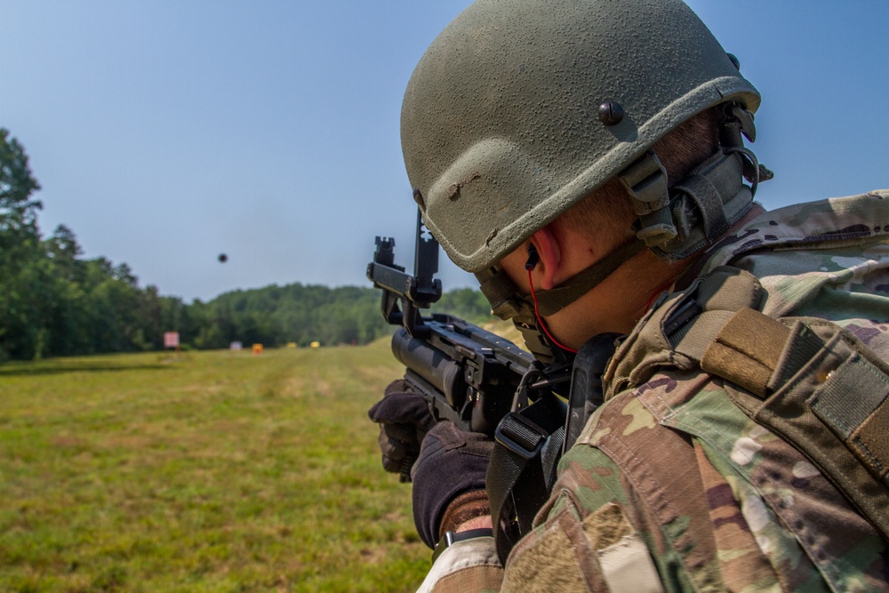 Staff Sgt. Jonathan Anderson shoots a M320 grenade launcher