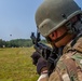 Staff Sgt. Jonathan Anderson shoots a M320 grenade launcher