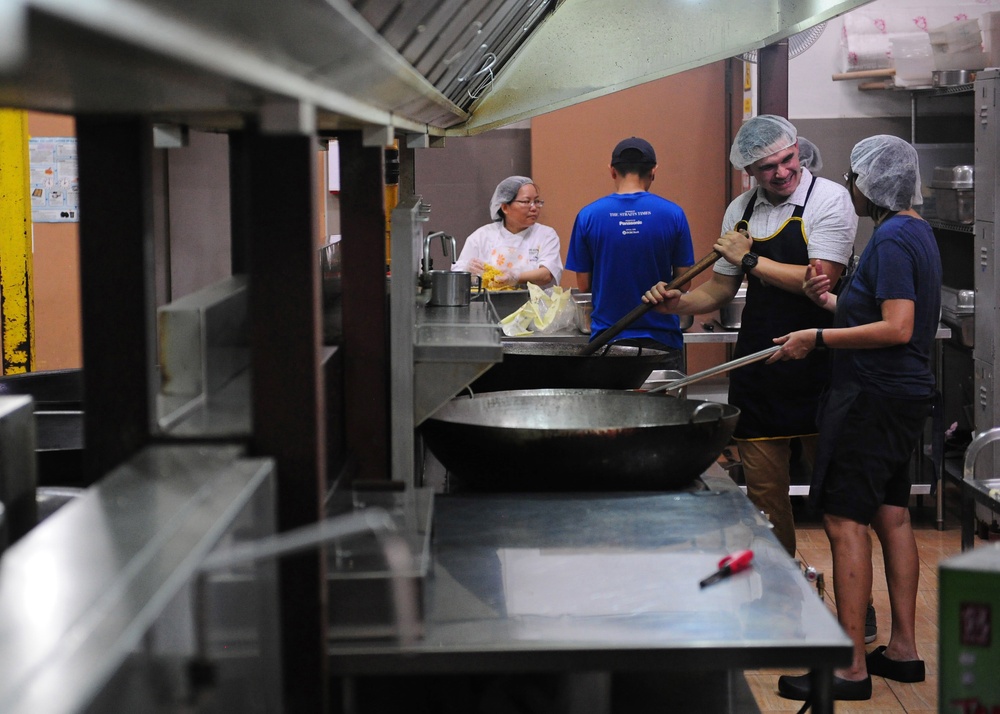 America ARG Sailors and Marines volunteer at Willing Hearts Soup Kitchen in Singapore