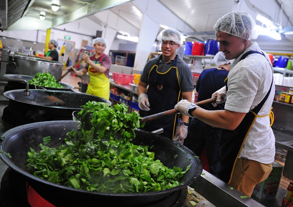 America ARG Sailors and Marines volunteer at Willing Hearts Soup Kitchen in Singapore