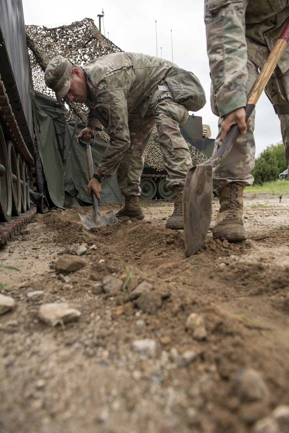 Soldiers Dig Trenches to Divert Rain Water