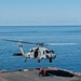 Sailros Hook Ordnance to an MH-60S Sea Hawk Aboard USS Bonhomme Richard (LHD 6)