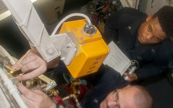 USS AMerica Sailors check sprinkler system