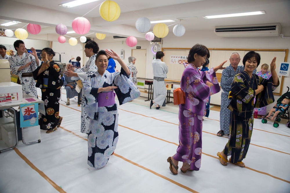 Americans dance with Japanese locals to honor ancestors