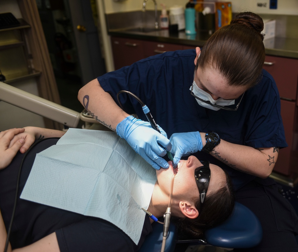 Hospital Corpsman Cleans Teeth