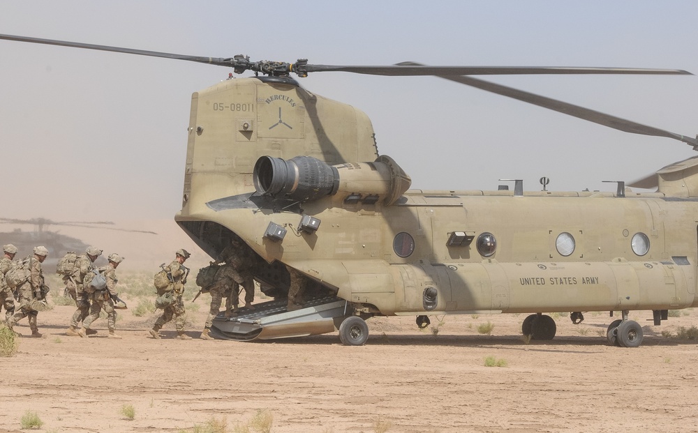Paratroopers load onto a CH-47 Chinook
