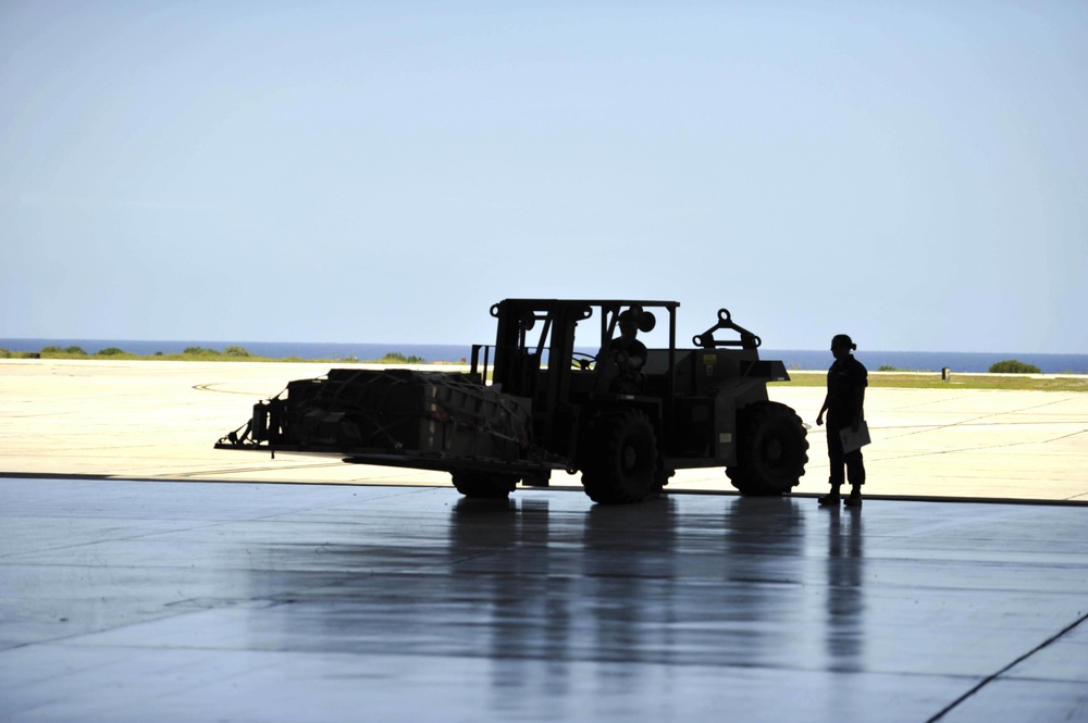 171717-G-DX668-1040 – AVDET GTMO crew members preparing to load gear using a fork truck