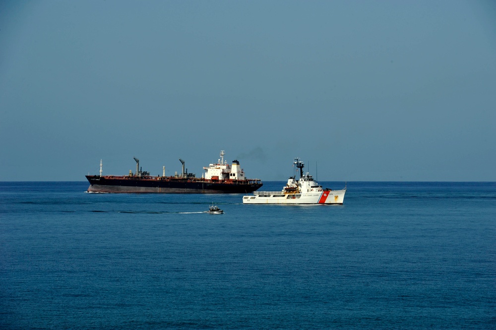 170719-G-DX668-1134 – PSU 305 crew members escorting CGC Reliance and a commercial ship through Guantanamo Bay, Cuba