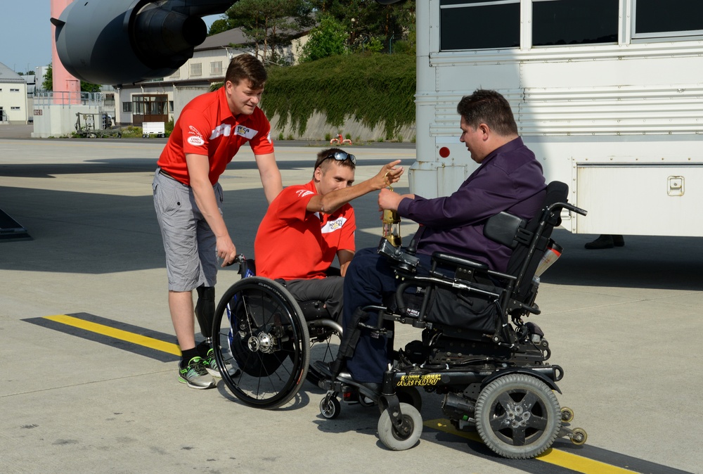 Former Landstuhl Regional Medical Center patients light Invictus Games torch before competition in Canada, thank medical team