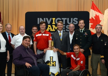 Former Landstuhl Regional Medical Center patients light Invictus Games torch before competition in Canada, thank medical team