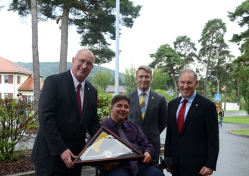 Former Landstuhl Regional Medical Center patients light Invictus Games torch before competition in Canada, thank medical team