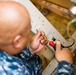 Hospital Corpsman Repairs Honduran Medical Equipment during SPS 17