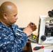 Hospital Corpsman Repairs Honduran Medical Equipment during SPS 17