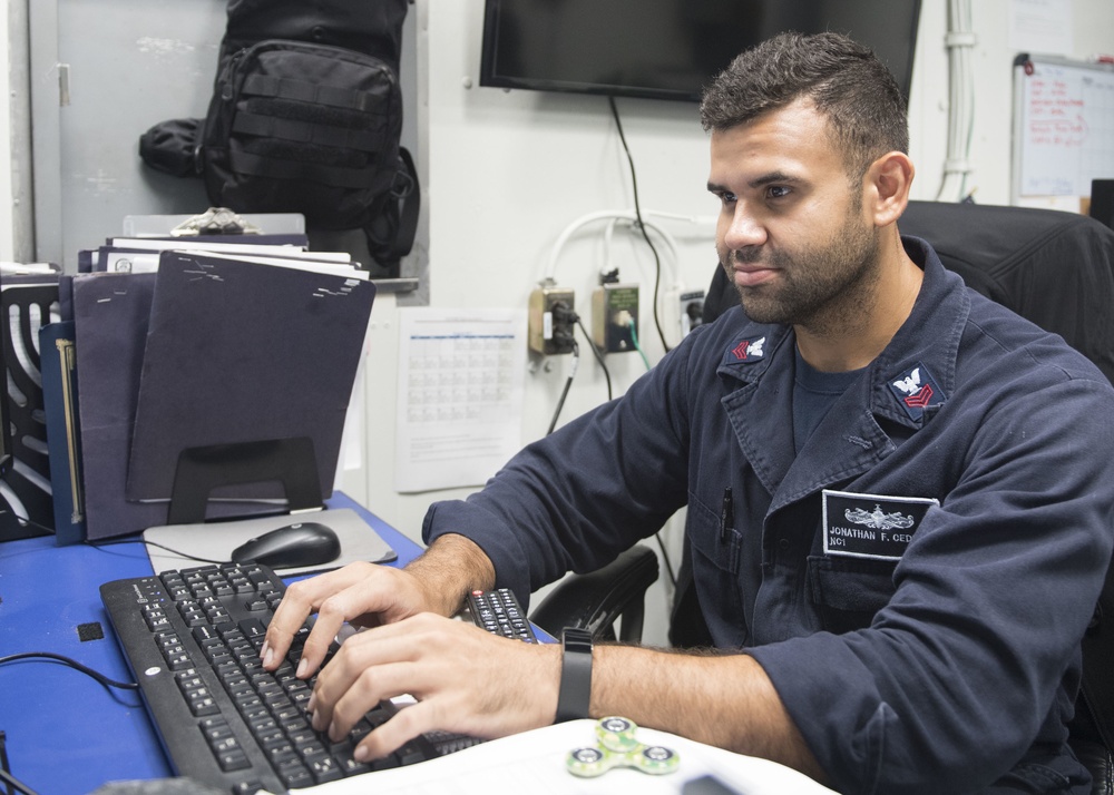 USS Lake Erie (CG 70) Sailors performs admin duties